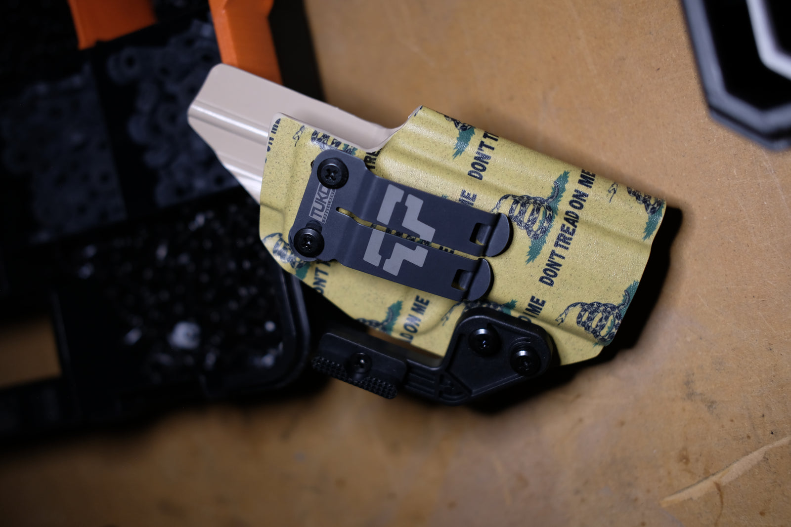 TUKD IWB Kydex holster in Don't Tread On Me Gadsden pattern with holstered pistol, hand formed in Las Vegas